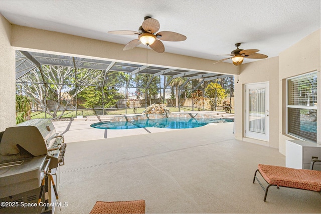 pool with glass enclosure, ceiling fan, and a patio