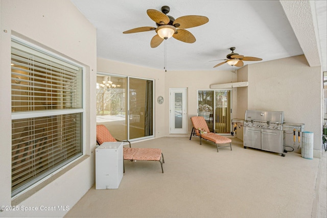 view of patio / terrace featuring a ceiling fan and grilling area