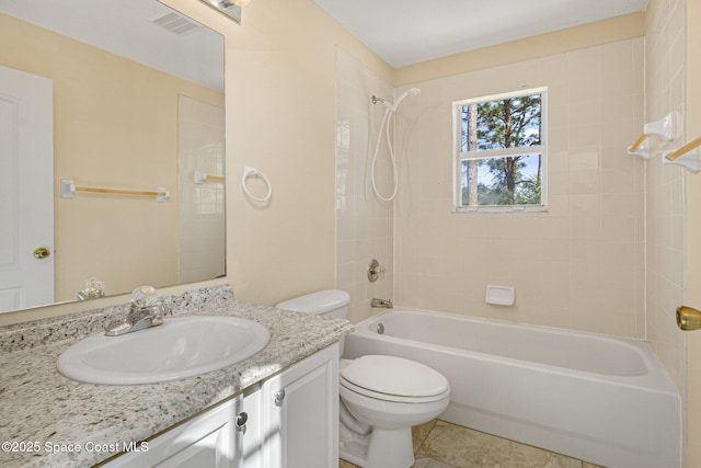 bathroom featuring shower / bath combination, visible vents, toilet, tile patterned floors, and vanity