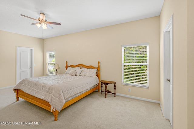 bedroom with carpet, baseboards, and ceiling fan