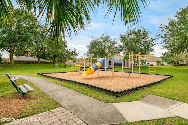 community playground featuring a lawn