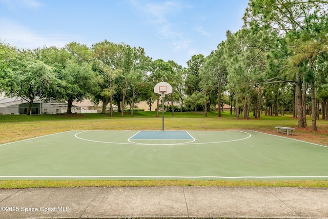 view of basketball court featuring community basketball court and a lawn