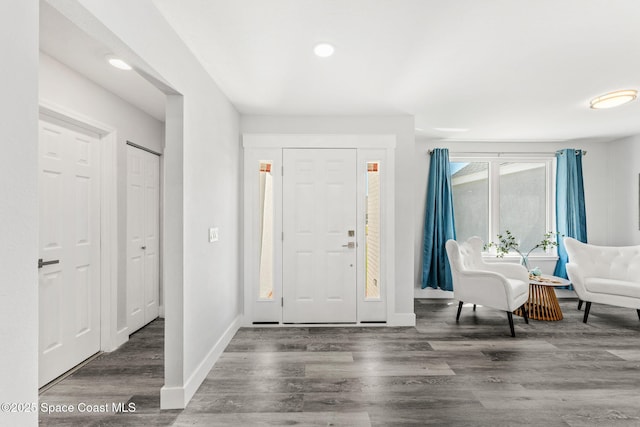 entrance foyer with wood finished floors and baseboards