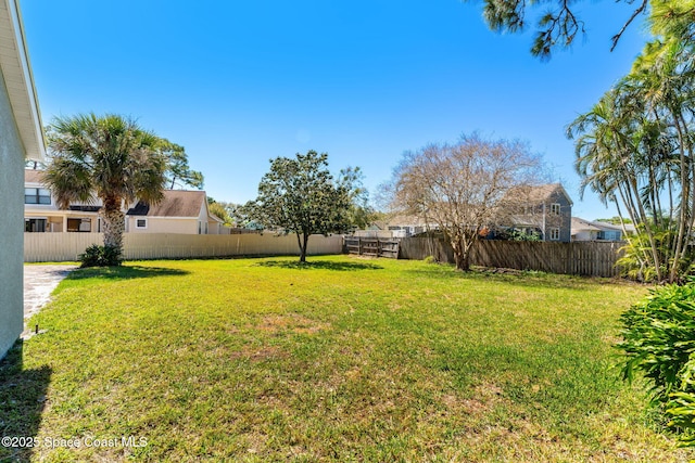 view of yard with a fenced backyard