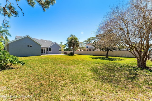 view of yard with fence