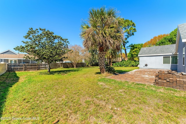 view of yard featuring a patio area and fence