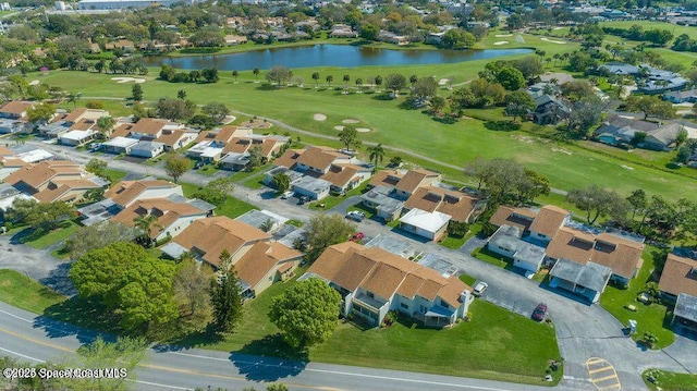 aerial view with a water view, view of golf course, and a residential view