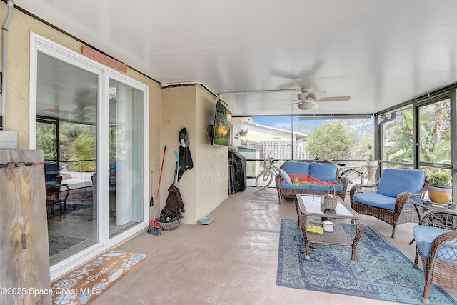 sunroom / solarium with a ceiling fan