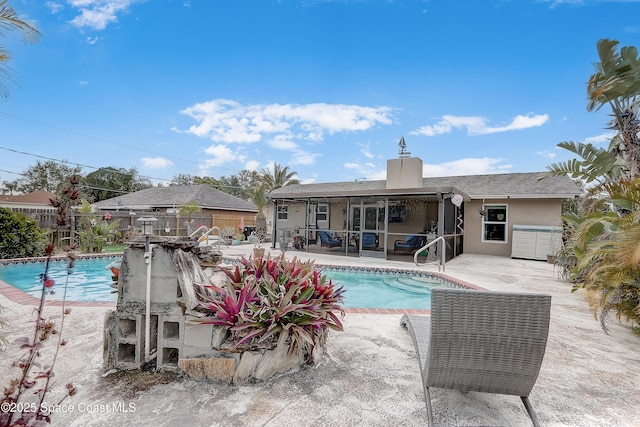 view of swimming pool with a fenced in pool, a patio area, and fence