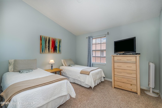 bedroom with light carpet, vaulted ceiling, and baseboards