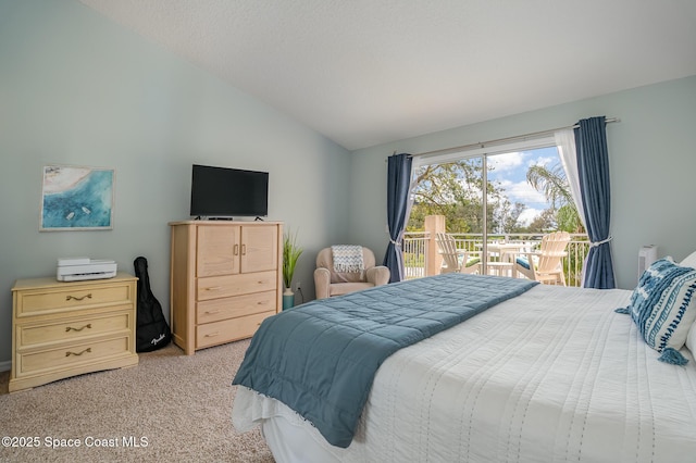 bedroom featuring lofted ceiling, access to exterior, and light carpet