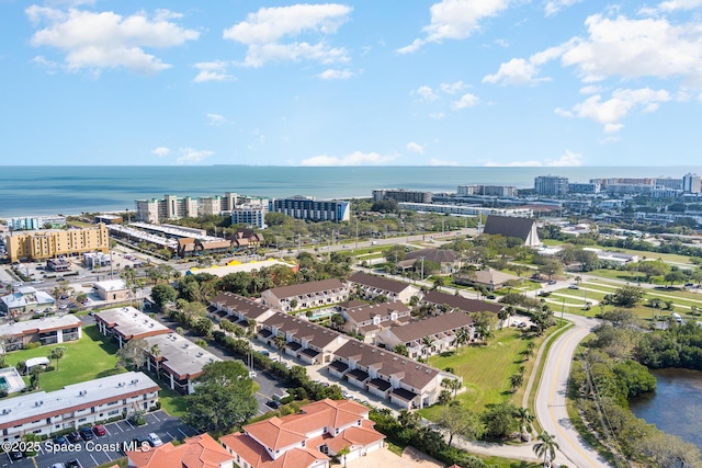 drone / aerial view featuring a water view and a city view