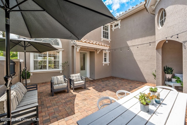 view of patio / terrace with outdoor dining space and an outdoor hangout area