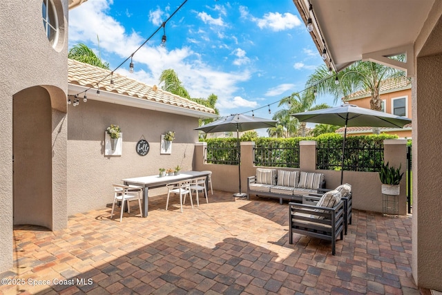 view of patio / terrace featuring outdoor lounge area and outdoor dining area