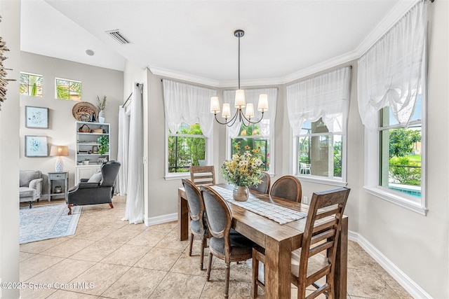 dining area featuring plenty of natural light, light tile patterned floors, visible vents, and an inviting chandelier