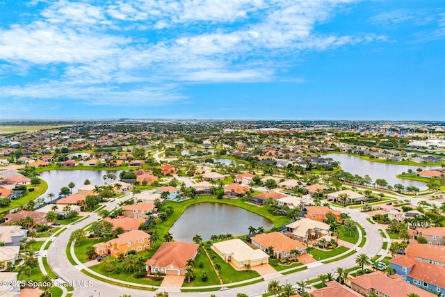 bird's eye view with a water view and a residential view