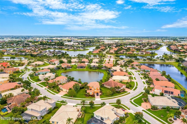 aerial view featuring a water view and a residential view