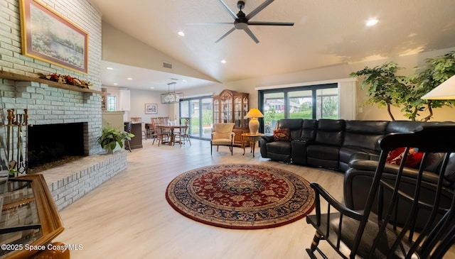 living area featuring high vaulted ceiling, recessed lighting, a ceiling fan, light wood-type flooring, and a brick fireplace