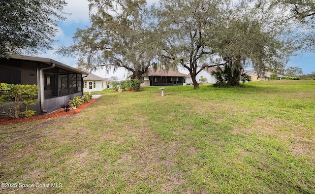 view of yard with a sunroom