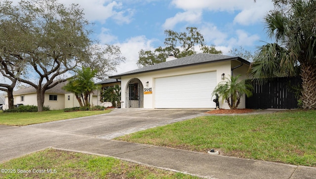 single story home featuring concrete driveway, a chimney, an attached garage, a front lawn, and stucco siding