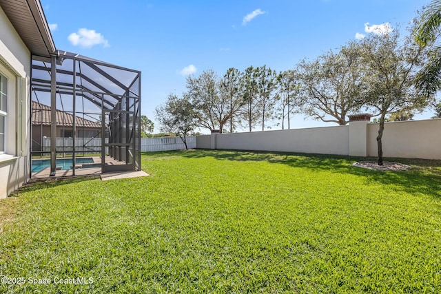 view of yard featuring a fenced in pool, a lanai, and a fenced backyard