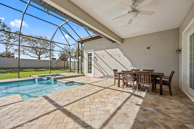 view of pool featuring glass enclosure, a patio, a hot tub, and ceiling fan