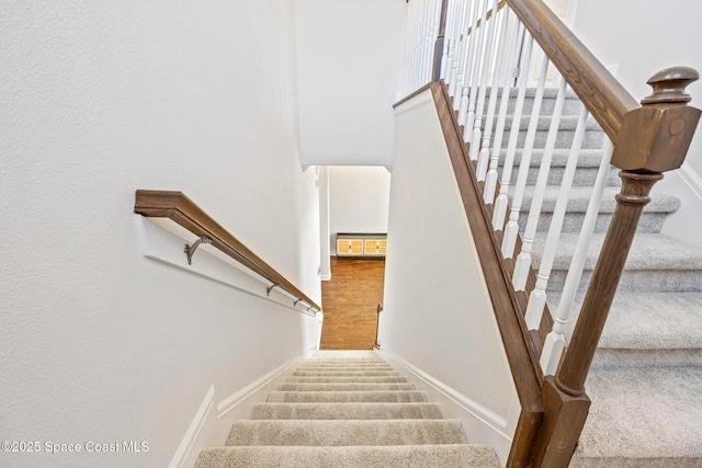 staircase with baseboards