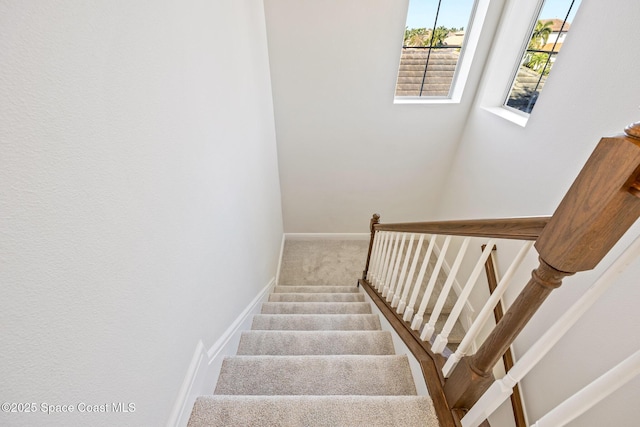 stairs with carpet and baseboards