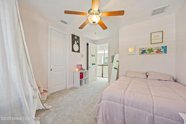 bedroom with ceiling fan, visible vents, and carpet flooring