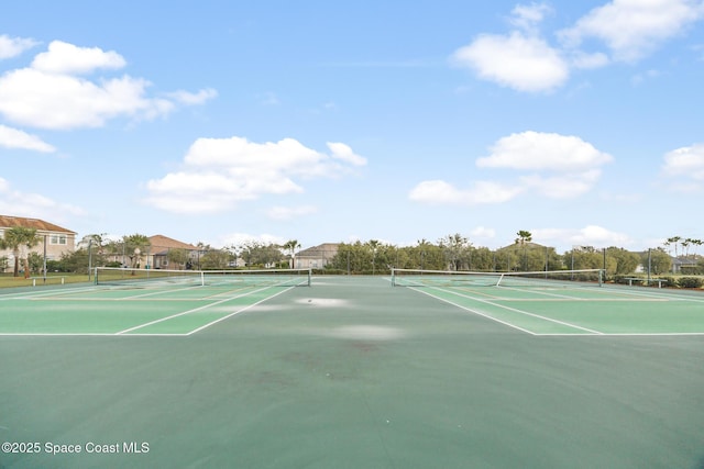 view of tennis court with fence