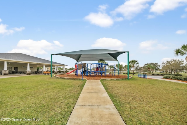 view of community with playground community and a lawn