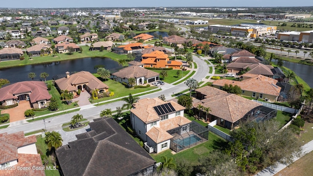 bird's eye view featuring a residential view and a water view