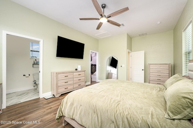 bedroom featuring attic access, multiple windows, visible vents, and baseboards