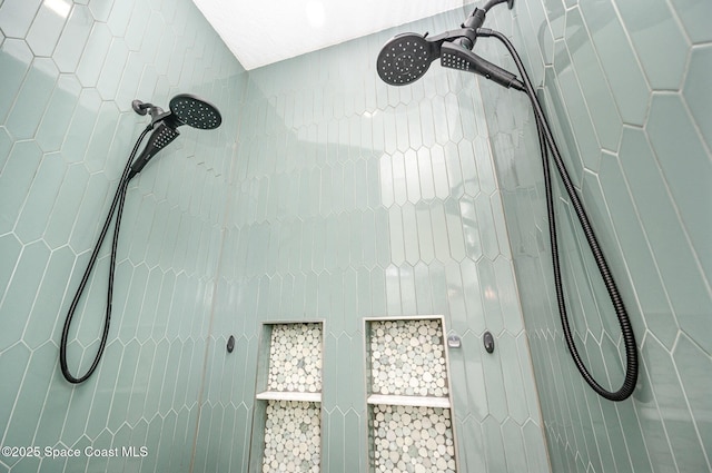 bathroom with tiled shower