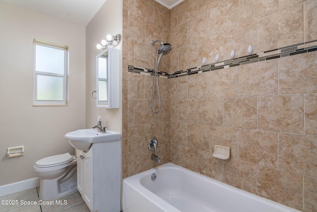 full bathroom featuring vanity, baseboards, bathtub / shower combination, tile patterned flooring, and toilet