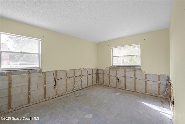 spare room featuring a textured ceiling