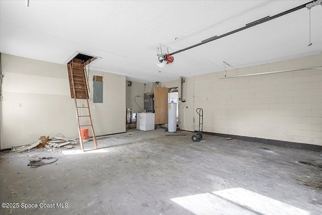 garage featuring gas water heater, concrete block wall, electric panel, and a garage door opener