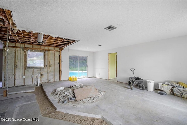 miscellaneous room featuring visible vents and a textured ceiling