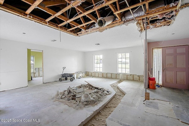 miscellaneous room featuring a textured ceiling