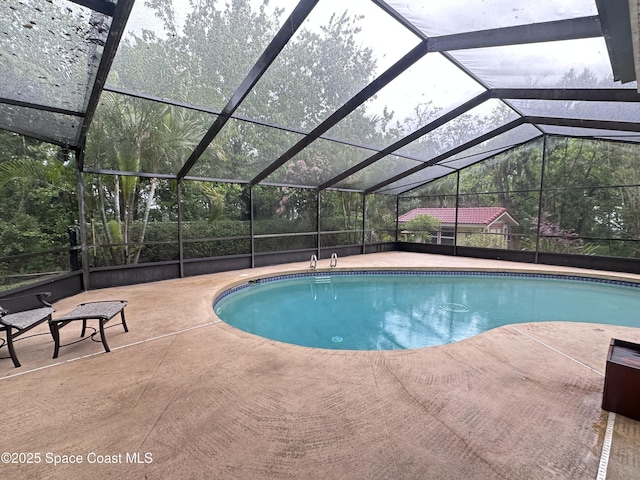 pool featuring a patio area and a lanai