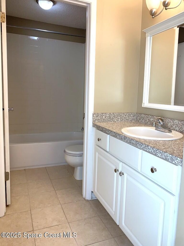 full bath with toilet, a textured ceiling, shower / tub combination, vanity, and tile patterned floors