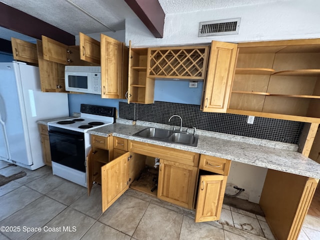 kitchen featuring white appliances, a sink, visible vents, decorative backsplash, and open shelves