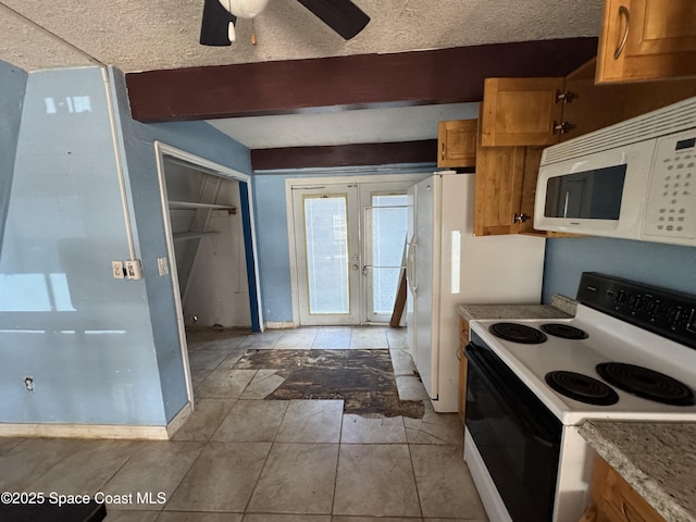 kitchen featuring brown cabinetry, beam ceiling, range with electric stovetop, and white microwave