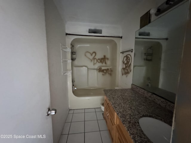 bathroom featuring toilet, vanity, and tile patterned floors