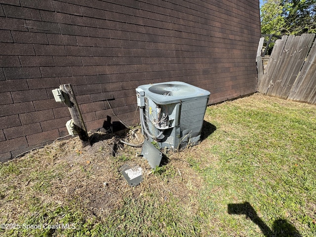 exterior details with fence and central AC unit