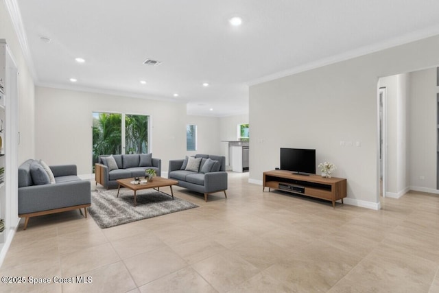 living area featuring baseboards, recessed lighting, visible vents, and crown molding