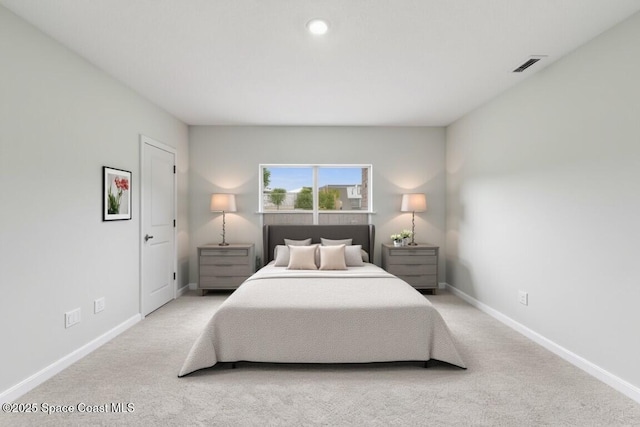 bedroom with carpet, baseboards, and visible vents