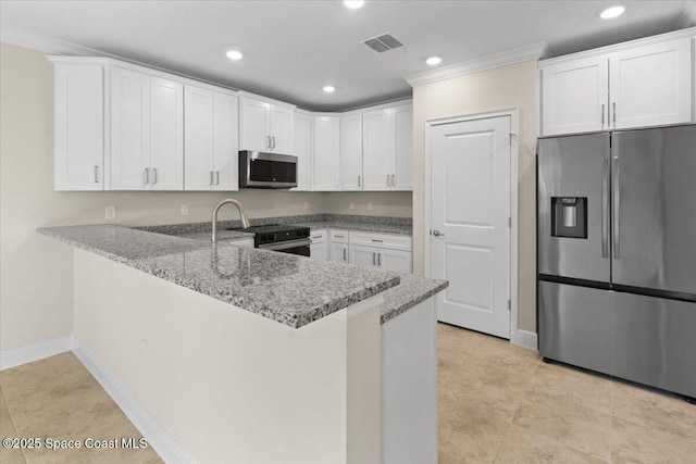 kitchen with stainless steel appliances, a peninsula, white cabinetry, visible vents, and light stone countertops