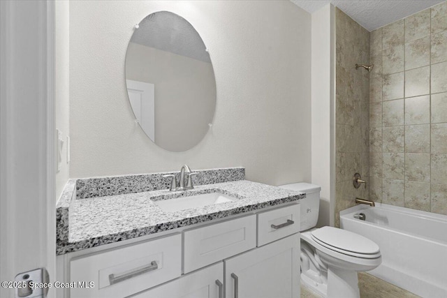 full bathroom featuring a textured ceiling, shower / tub combination, vanity, and toilet