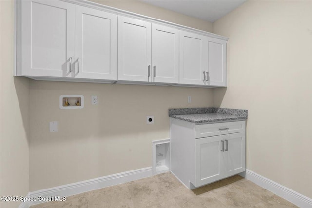 laundry room with baseboards, hookup for a washing machine, cabinet space, and hookup for an electric dryer